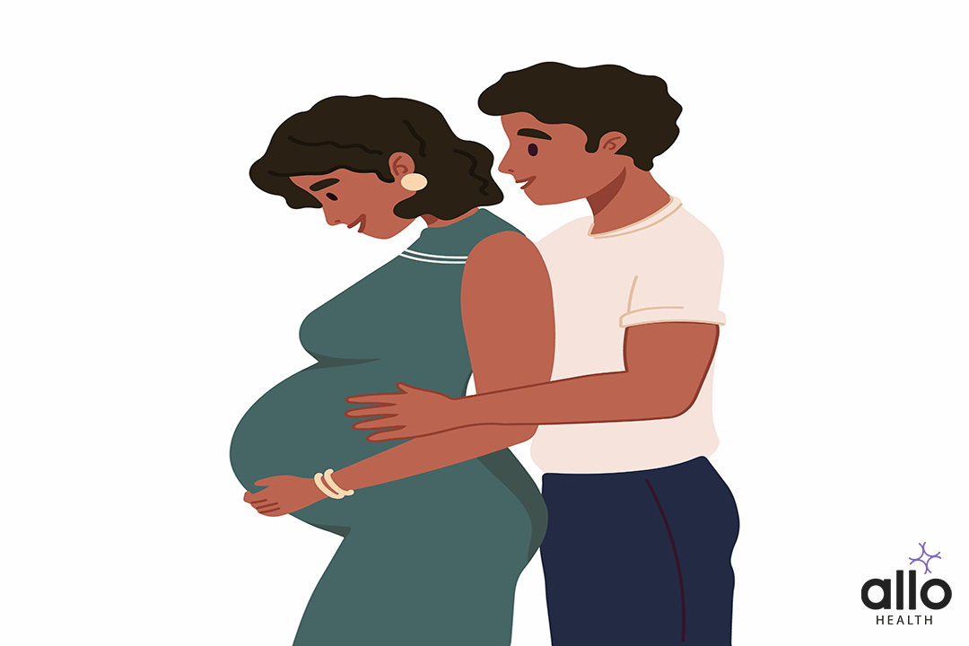 man holding his pregnant woman's belly