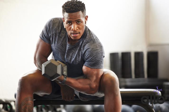 Black man, bodybuilder and dumbbell in gym portrait for fitness, focus or training for growth, goal or competition. African guy, weightlifting and strong arms for training, wellness and muscle health. does masturbation affect muscle gains, Physical Changes With Aging